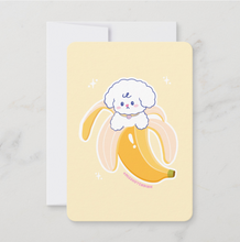 Load image into Gallery viewer, cute illustration of a dog in a banana peel on a light yellow background
Mini art print featuring a cute Bibo dog character peeking out of a peeled yellow banana, centered on a soft yellow background.