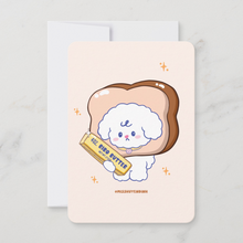 Load image into Gallery viewer, Card with a cute illustration of a dog on a piece of bread with a butter stick, on a light gray background.
A cute mini art print featuring Bibo the dog character with his head inside a slice of bread, holding a stick of 'Bibo Butter' on a soft cream background