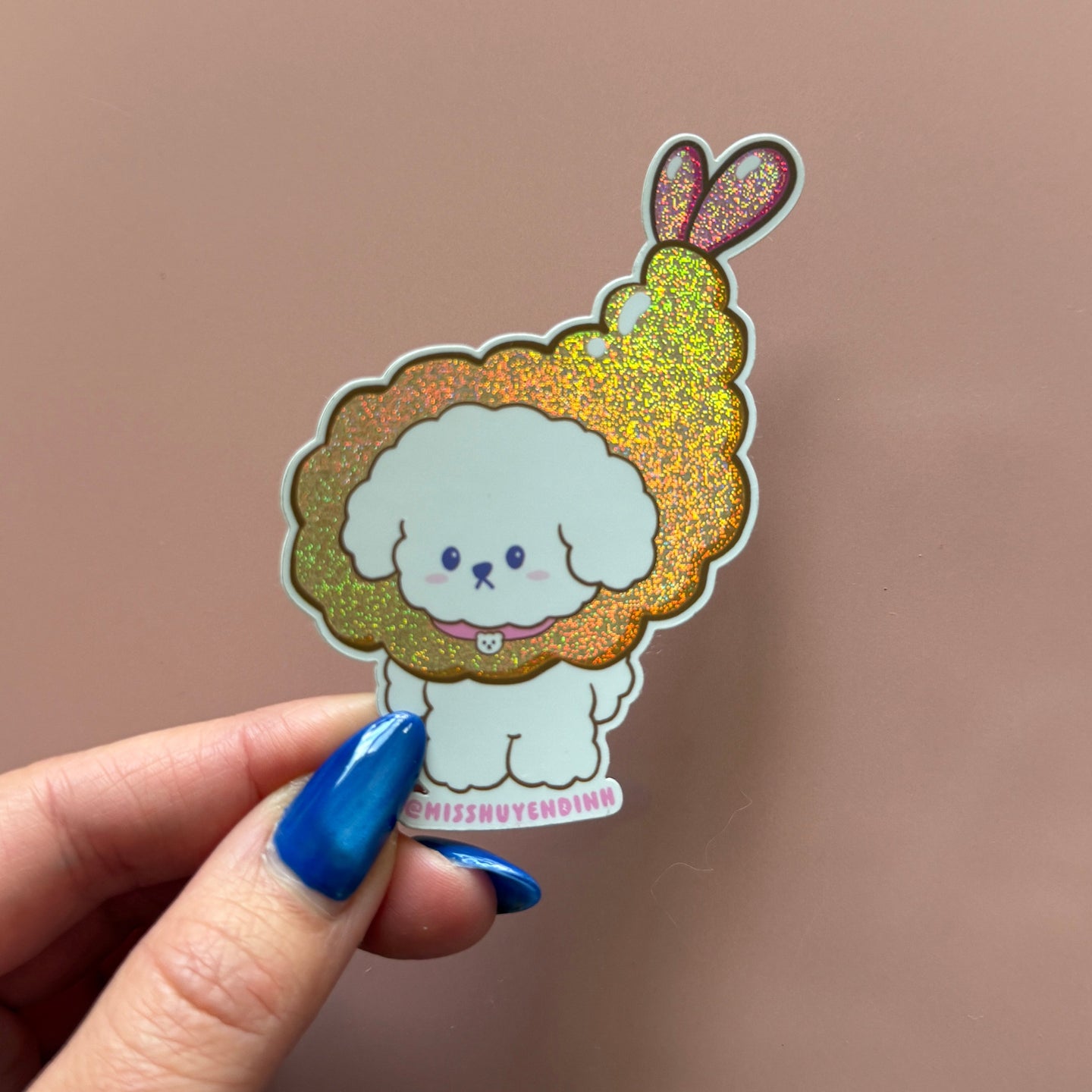 Hand holding a colorful cloud-shaped shrimp tempura  sticker 