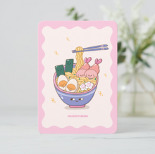 Load image into Gallery viewer, A playful mini art print of a blue ramen bowl with a face, filled with noodles, eggs, and Bibo dog characters as shrimp tempura and narutomaki.
